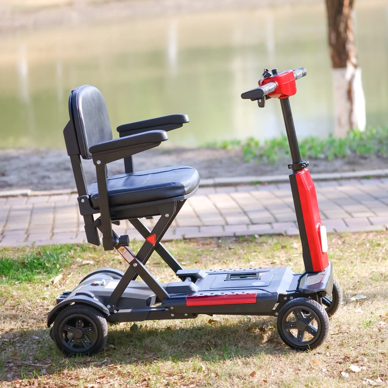 Red and black EXC-1003B automatic folding mobility scooter in park setting